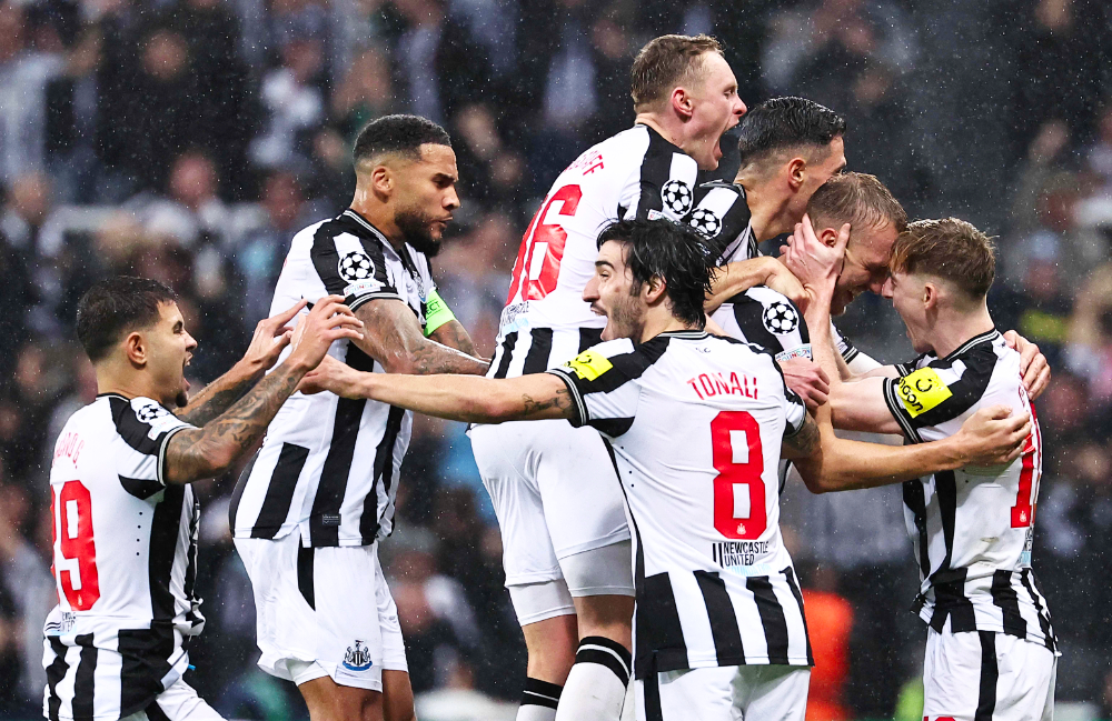 Newcastle players celebrate after Dan Burn scored. (AFP)