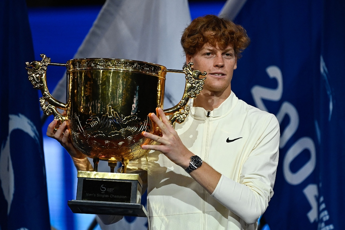 Italy's Jannik Sinner with the champion trophy after defeating Russia's Daniil Medvedev in the men's singles final at the China Open tennis tournament in Beijing on Wednesday. (AFP)