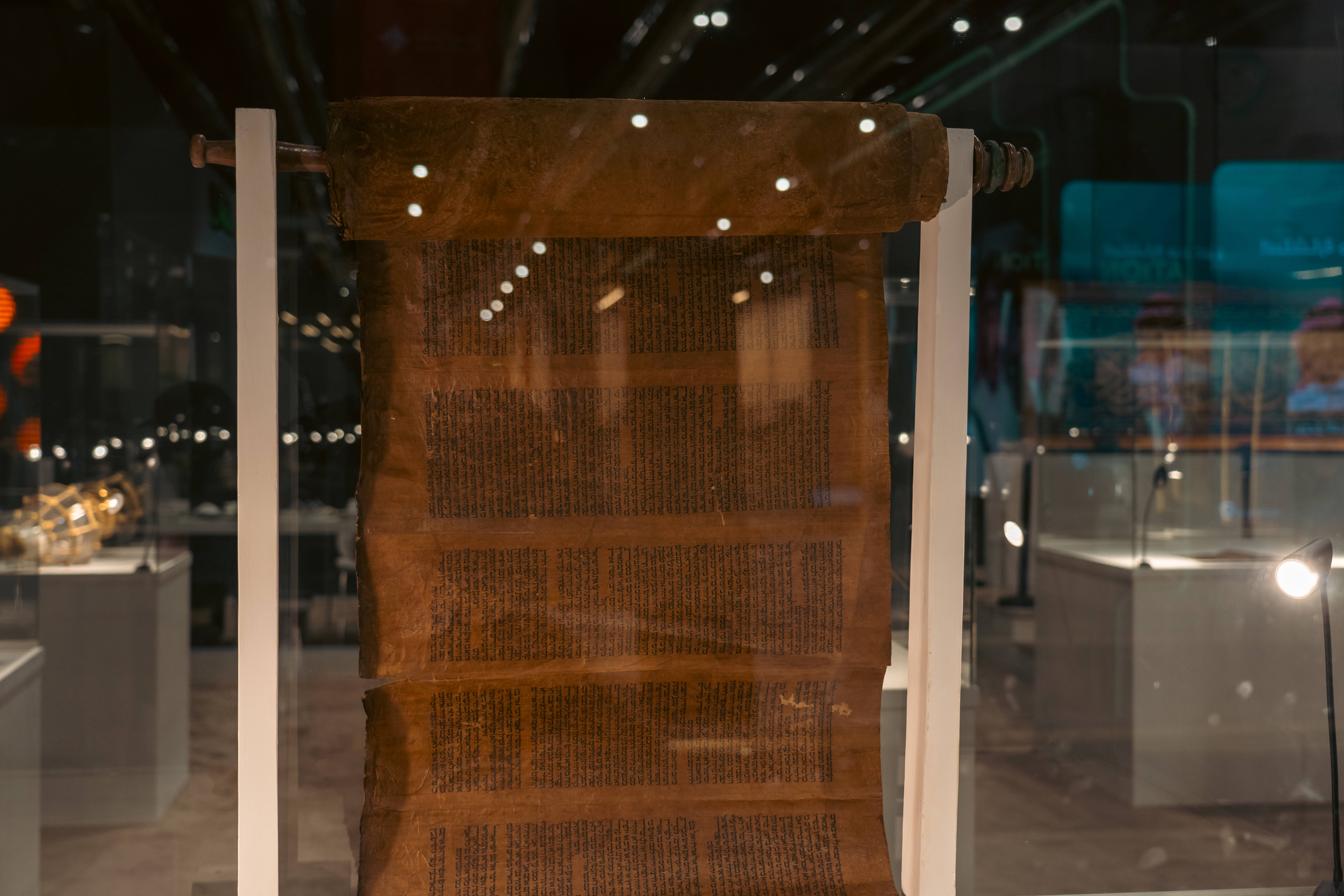 The scroll — written in Hebrew, and about 40 meters in length and 90 centimeters in width — is displayed in a secure glass case as part of a special pavilion. (AN photo by Abdulrhman Bin Shalhoub)