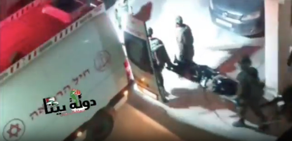 In this video grab, Israeli soldiers are seen taking away the body of a Palestinian gunman slain during clashes in Hawara town in the occupied West Bank on Oct. 5, 2023. (X: @QudsNen)