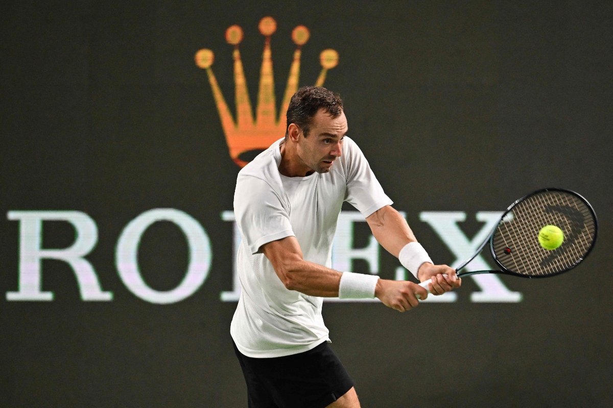Roman Safiullin of Russia hits a return to Alexander Zverev of Germany during their men's singles match at the Shanghai Masters tennis tournament in Shanghai on Friday. (AFP)