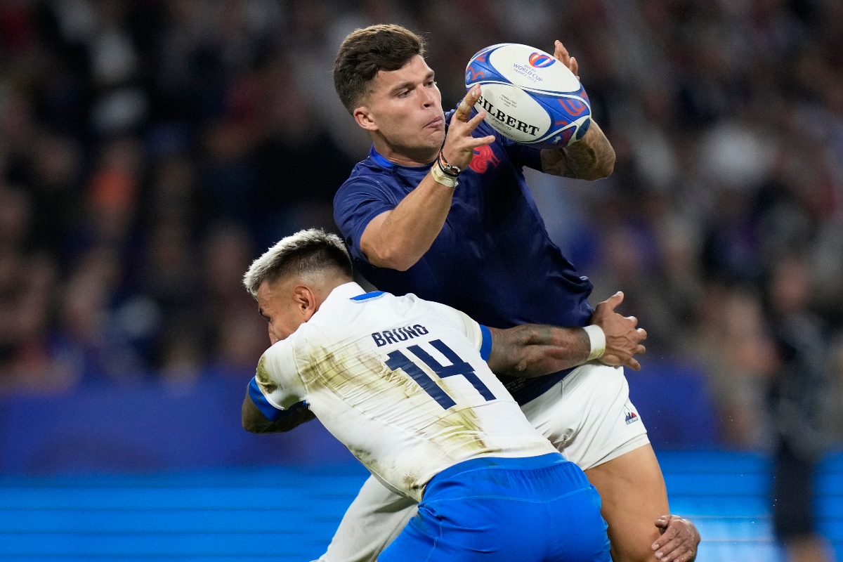 France's Matthieu Jalibert passes the ball during the Rugby World Cup Pool A match between France and Italy at the OL Stadium in Lyon, Fran3. (AP)