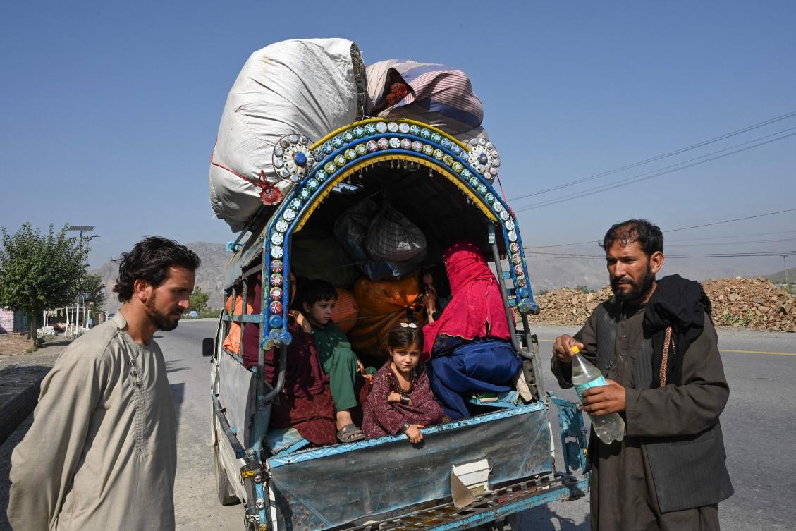 The Pakistan government denies targeting Afghans and says the focus is on people who are in the country illegally, regardless of their nationality. Above, Afghan families in Jamrud area of Khyber district west of Peshawar on Oct. 6, 2023, as they return to Afghanistan. (AFP)