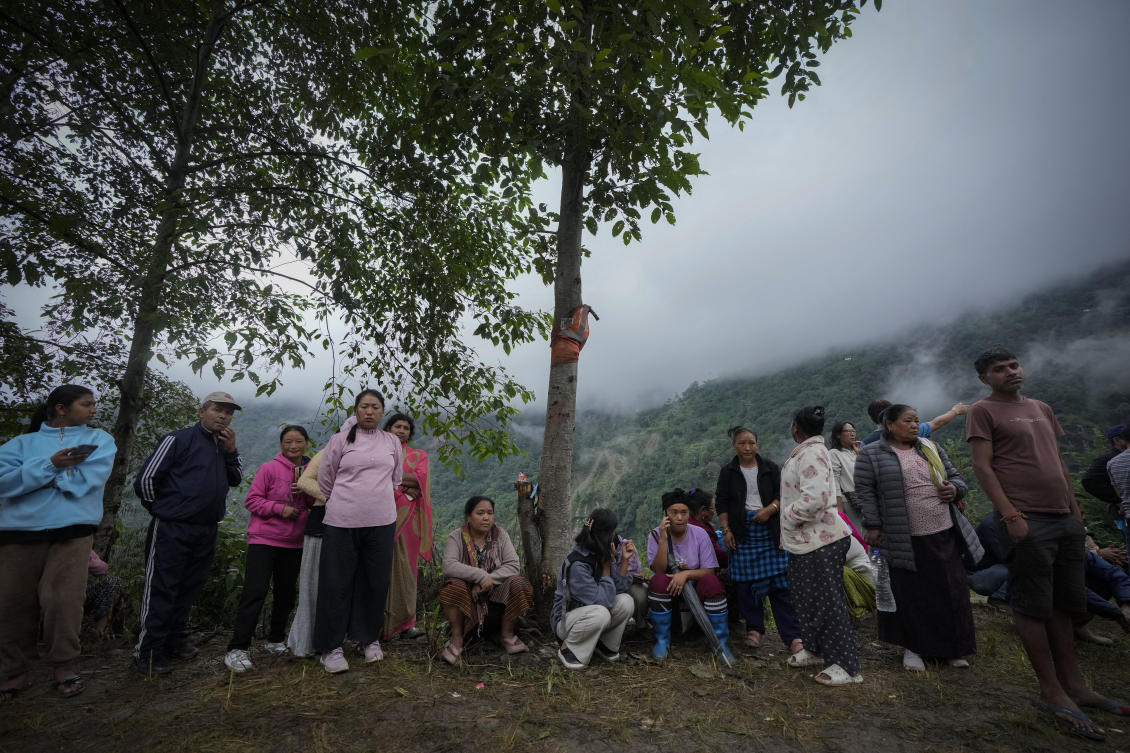 Flood affected villagers wait to meet Sikkim chief minister Prem Singh Tamang in Naga village in north Sikkim, India, on Oct. 7. 2023. (AP)