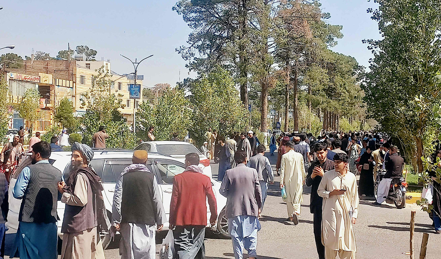 People gather on the streets after an earthquake in Herat, Afghanistan on October 7, 2023. (AFP)