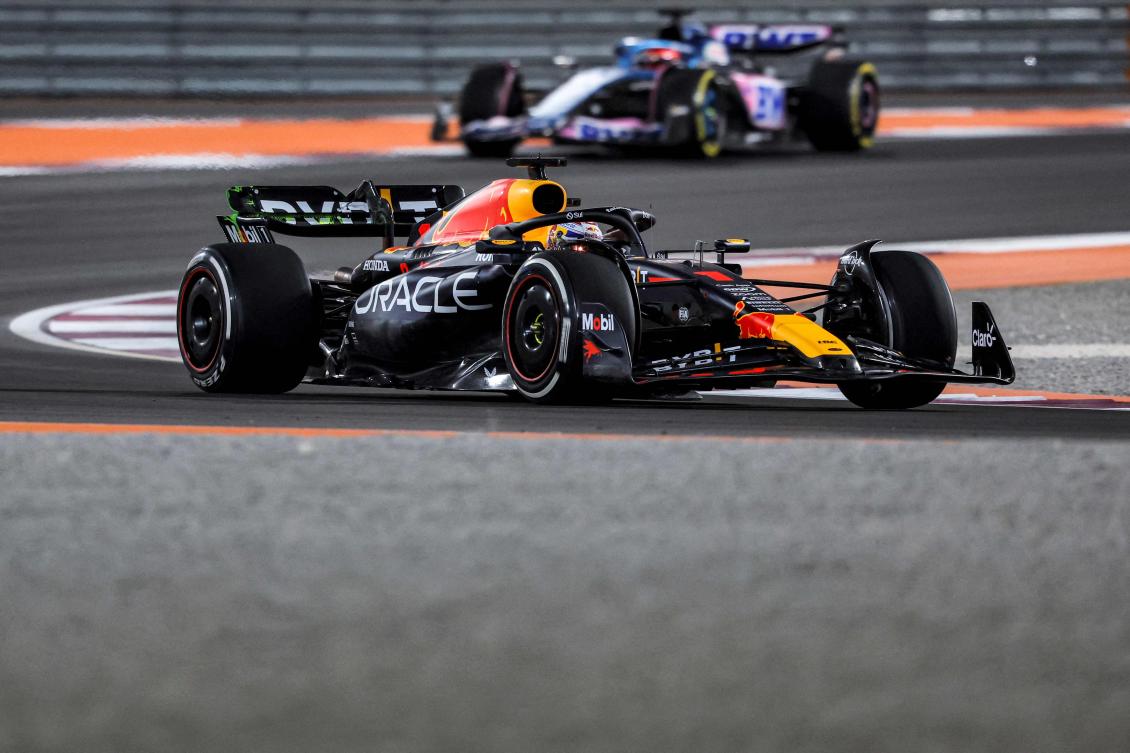 Red Bull Racing’s Dutch driver Max Verstappen (foreground) drives ahead of Alpine’s French driver Esteban Ocon during the first practice session ahead of the Qatari F1 Grand Prix at the Losail International Circuit in Doha on Oct. 6, 2023. (AFP)