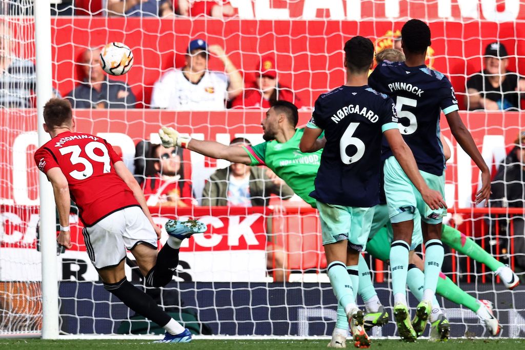 Manchester United's Scottish midfielder Scott McTominay (L) heads home their late winning goal during the English Premier League match between Manchester United and Brentford at Old Trafford in Manchester, north west England, on Saturday. Man Utd won 2-1. (AFP)