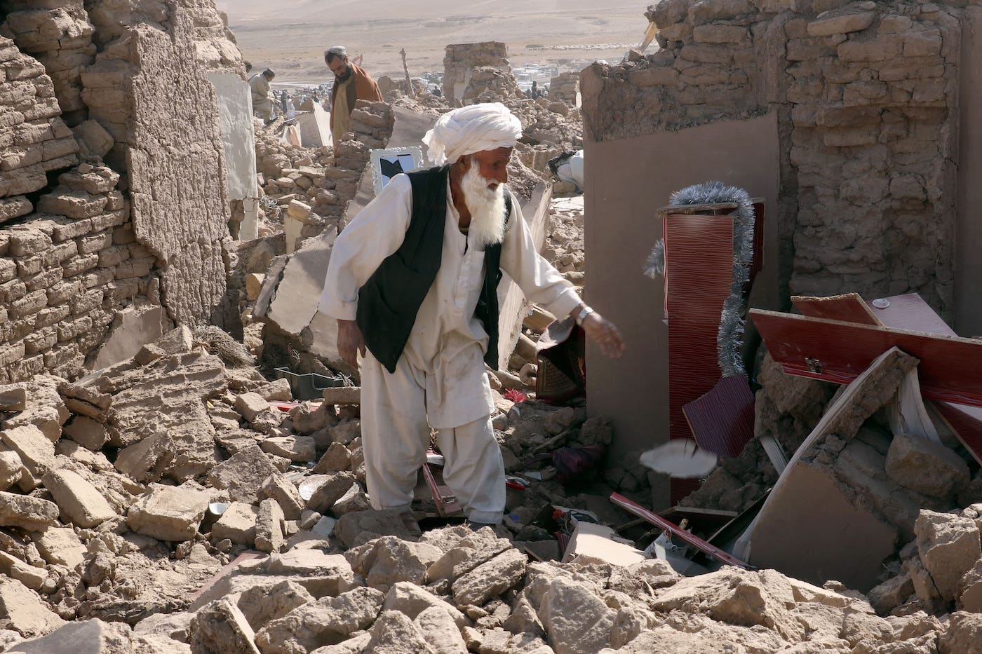 A man cleans up after an earthquake in Zenda Jan district, Herat province, Afghanistan on Oct. 8, 2023. (AP)
