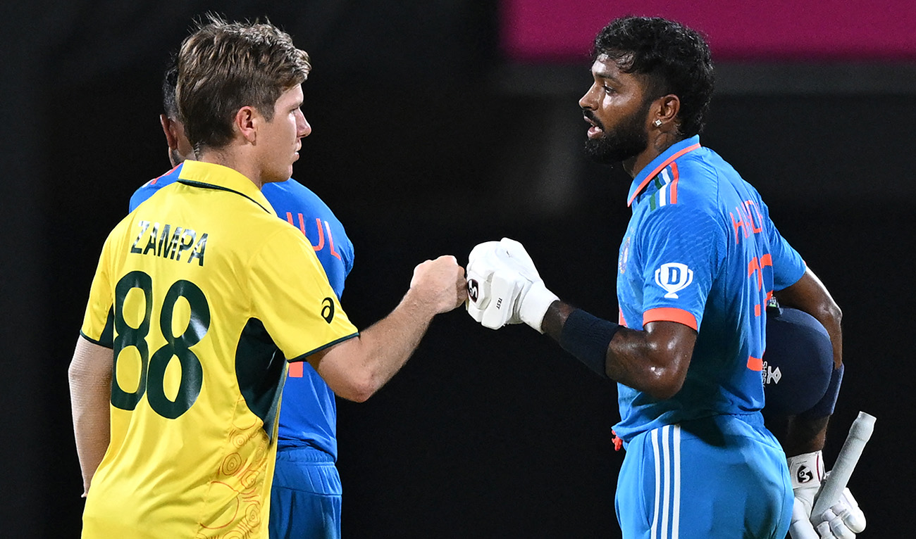 India's Hardik Pandya (R) bumps fists with Australia's Adam Zampa at the end of the 2023 ICC Men's Cricket World Cup one-day international (ODI) match between India and Australia at the MA Chidambaram Stadium in Chennai on October 8, 2023. (AFP)