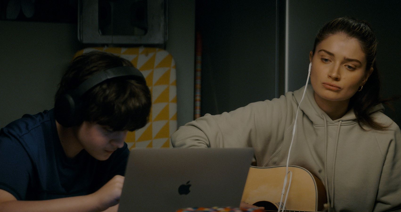 Desperate to connect with her troublesome son Max (Oren Kinlan), single mother Flora (Eve Hewson) finds and rescues a discarded guitar and encourages him to learn. (Supplied)