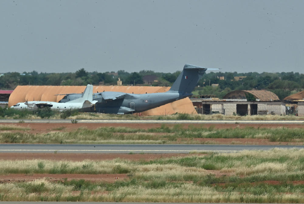 France has begun withdrawing its troops from Niger after being ordered out of the West African nation by the leaders of the July coup. Above, a French air force plane at the French air base in Niamey. (AFP)