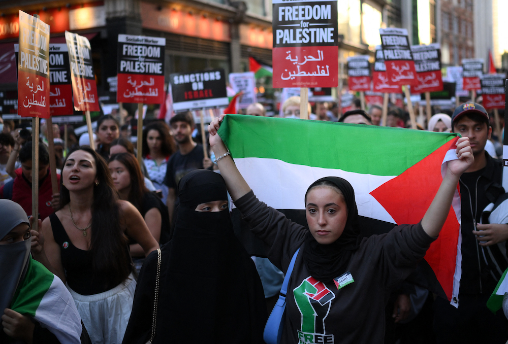 Above, people take part in a ‘Stand with Palestine’ demonstration in west London on Oct. 9, 2023. (AFP)
