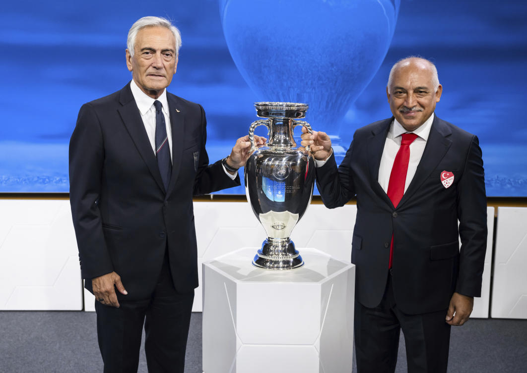 Gabriele Gravina, left, President of the Italian Football Federation, and Mehmet Buyukeksi, President of the Turkish Football Federation, pose together after Italy and Turkiye were elected to host the Euro 2032 tournament. (AP)