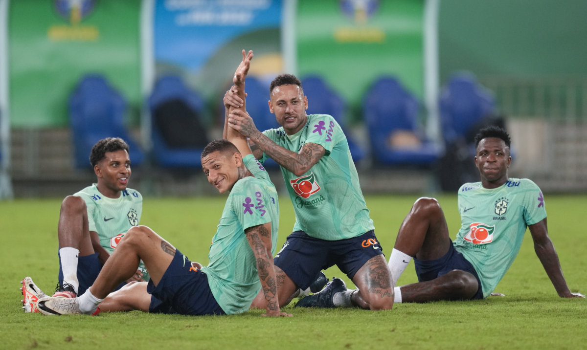 Brazil's Neymar, center, jokes with Richarlison as teammates Rodrygo, left, and Vinicius Junior, right, look on, during a training session in Cuiaba, Brazil, Tuesday. Brazil will face Venezuela in a World Cup 2026 qualifying soccer match on Thursday. (AP)