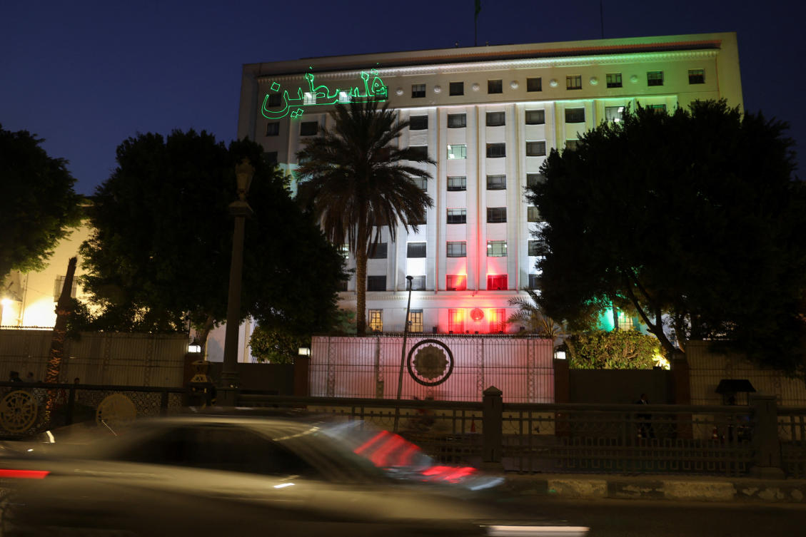 An Arabic sign reading "Palestine" is projected on the Arab League headquarters, in support of Palestinians on the day the league's foreign ministers met to discuss the Israeli-Palestinian conflict, in Cairo on Oct.11, 2023. (Reuters)