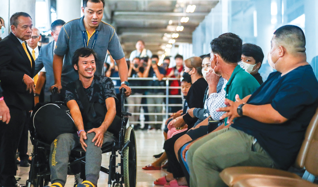 Katchakorn Pudtason, a migrant agricultural worker injured in Israel, arrives at Bangkok’s Suvarnabhumi Airport on Thursday after being repatriated from Israel. (Reuters)