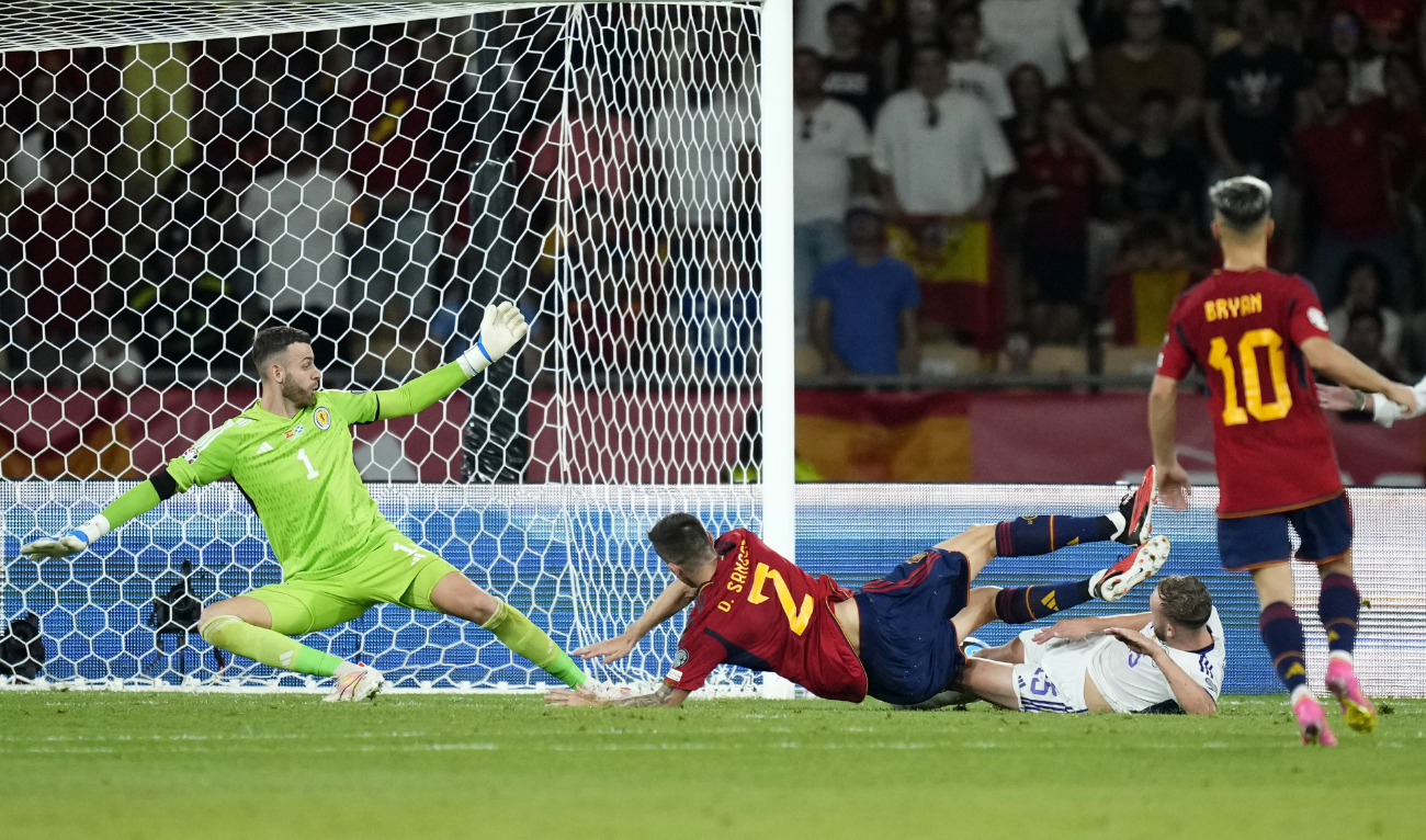 Spain's Oihan Sancet, center, scores his side's second goal during the Euro 2024 group A qualifying soccer match between Spain and Scotland at La Cartuja stadium in Seville, Spain, Thursday. (AP)