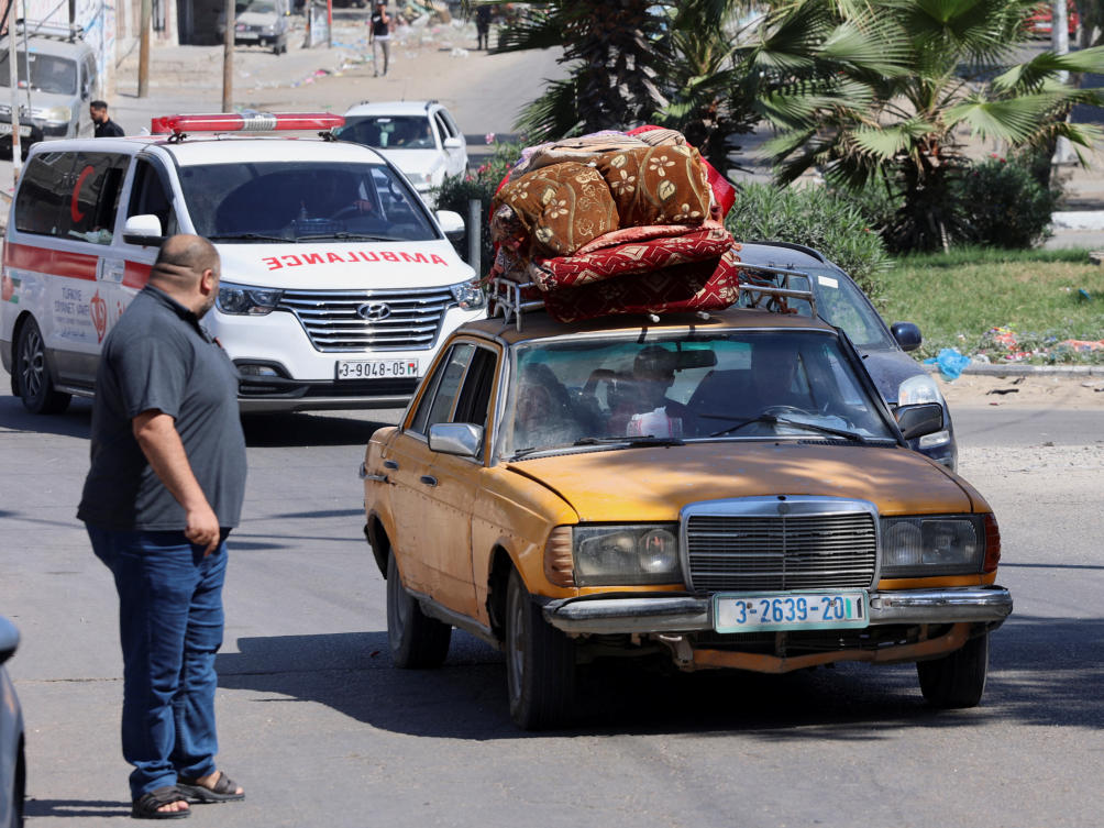 Palestinians flee their houses heading toward the southern part of Gaza Strip after Israel’s call for more than 1 million civilians in northern Gaza to move south within 24 hours, amid the Israeli-Palestinian conflict in Gaza City on Oct. 13, 2023. (Reuters)