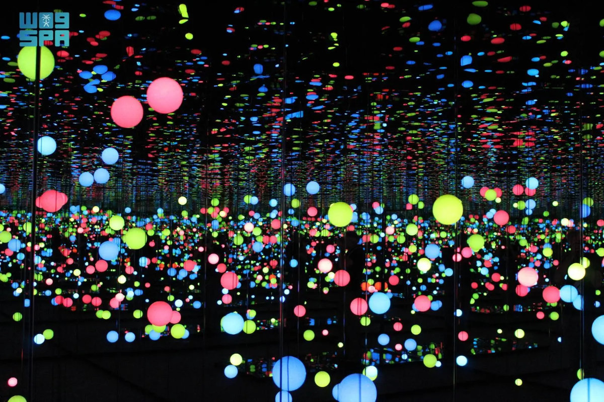 Spheres of multicolored light hang at different heights and intervals from the ceiling in this file photo of Japanese artist Kusama Yayoi stunning masterpiece titled “Brilliance of the Souls”. (Social media photo)