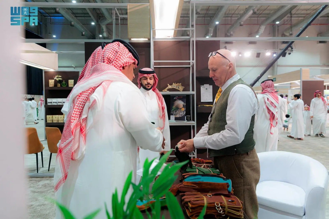 British glove maker Calvin Crossman, right, peddles his high-quality products on the occasion of the International Saudi Falcons and Hunting Exhibition 2023 in Riyadh. (SPA)
