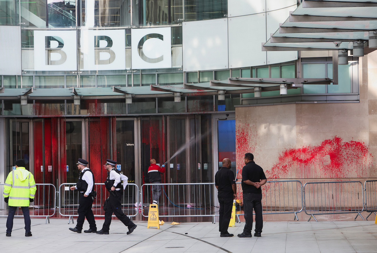 Police officers walk outside the BBC building, near where a march for a protest in solidarity with Palestinians is set to begin, covered in red paint, amid the ongoing conflict between Israel and the Palestinian group Hamas. (Reuters)