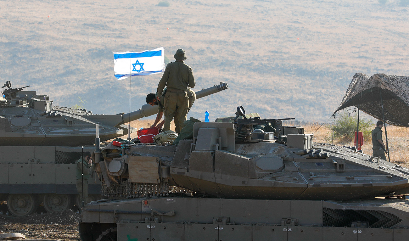 Israeli Merkava tanks are positioned in the north of Israel near the border with Lebanon on October 15, 2023. (AFP)