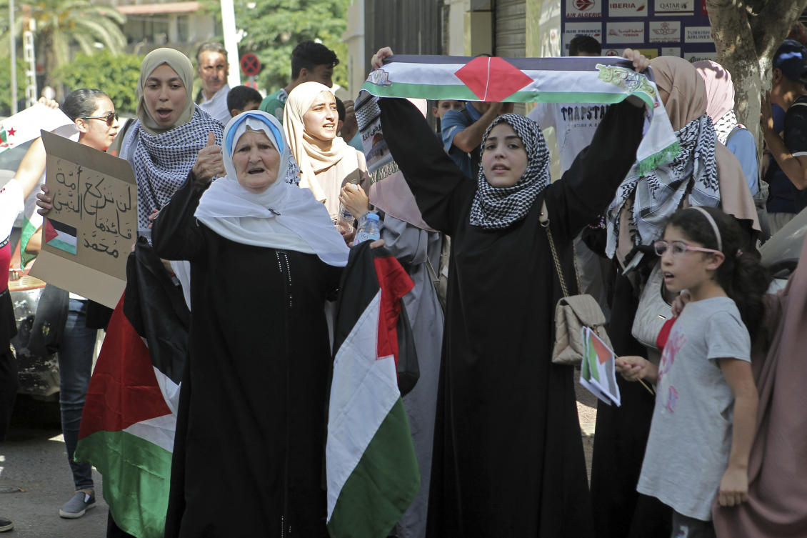 People take part in a protest in solidarity with Palestinians in Gaza, in downtown Algiers, Friday, Oct. 13, 2023. (AP)