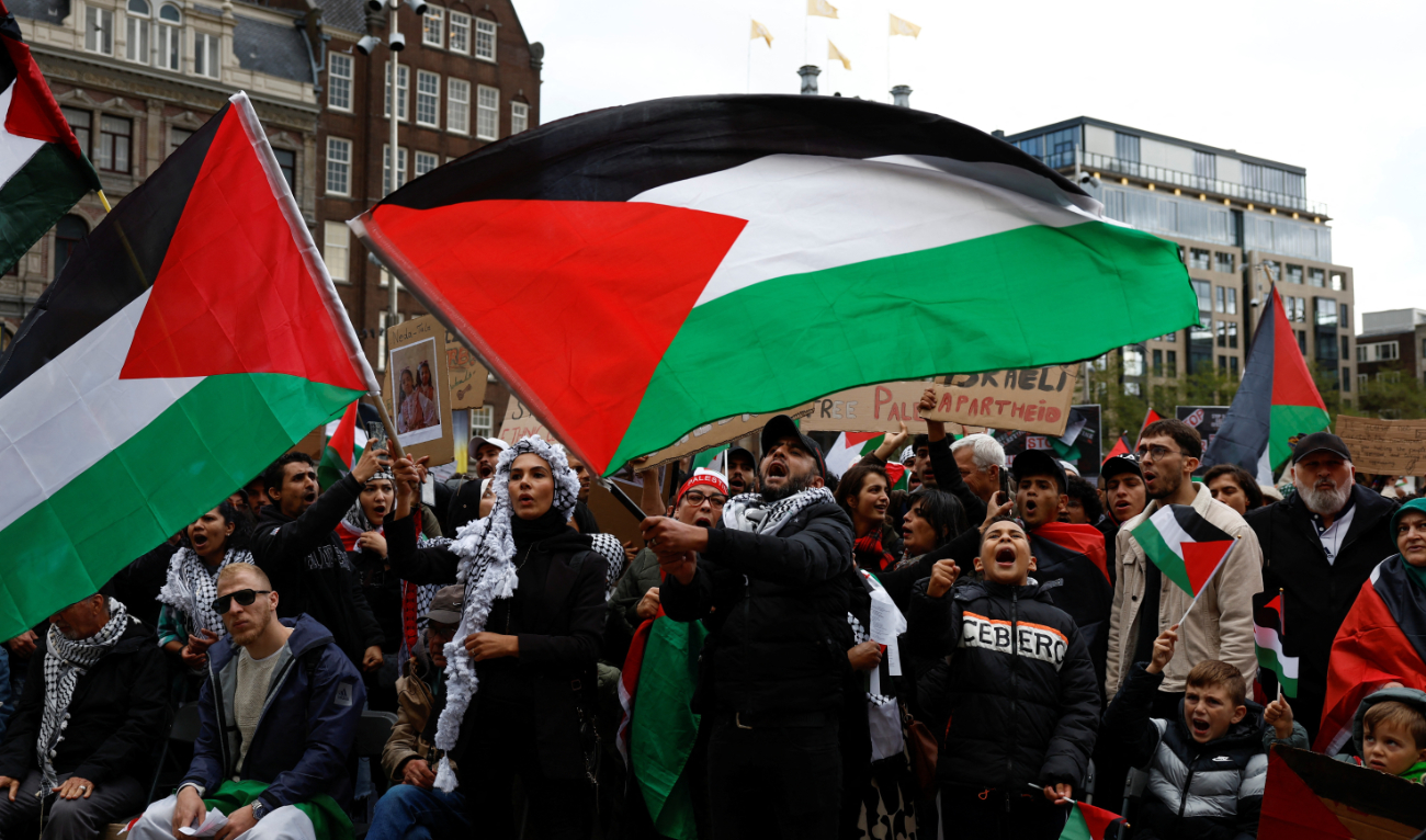 People hold a demonstration on Sunday in support of Palestinians in Amsterdam, Netherlands. The protesters turned the central Amsterdam square into a sea of Palestinian flags and placards. (Reuters)