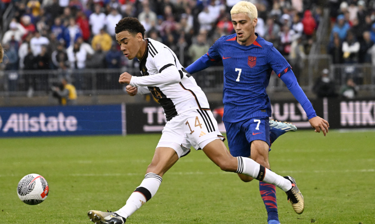 Germany's Jamal Musiala plays the ball as Gio Reyna of the US, right, follows during an international friendly soccer match at Pratt & Whitney Stadium at Rentschler Field, Saturday in East Hartford, Conn. (AP)