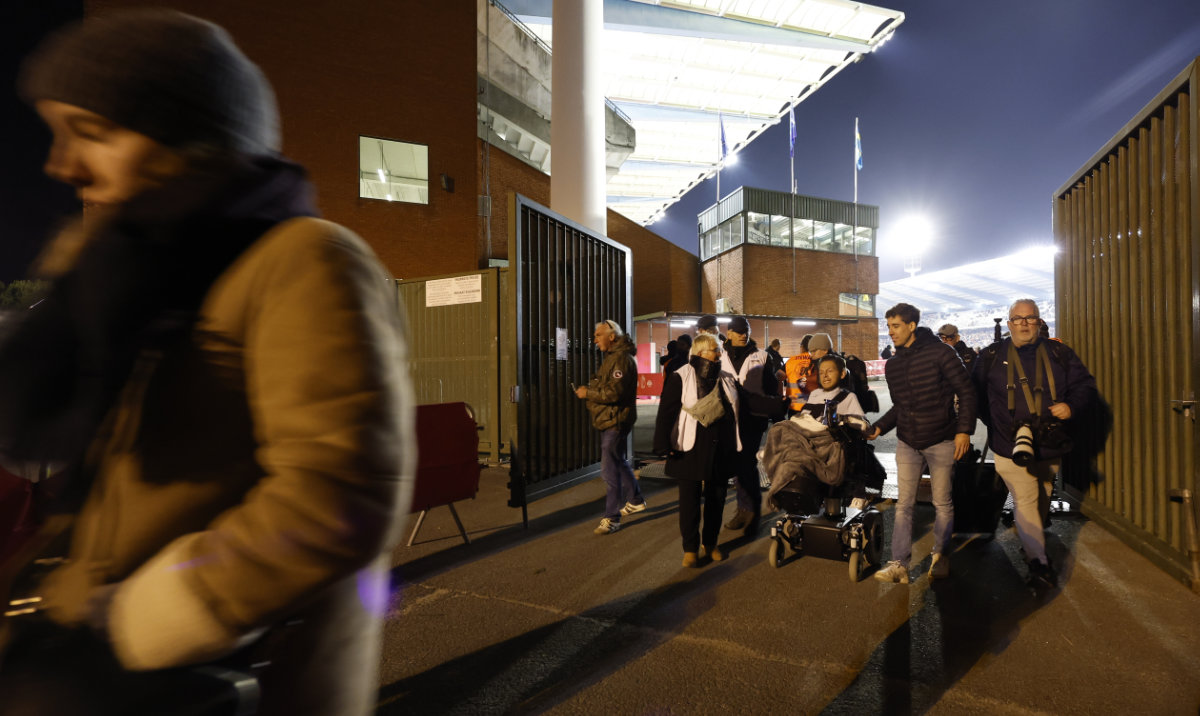 Supporters walk away from the venue after suspension of the Euro 2024 Group F qualifying soccer match between Belgium and Sweden at the King Baudouin Stadium in Brussels Monday. (AP)