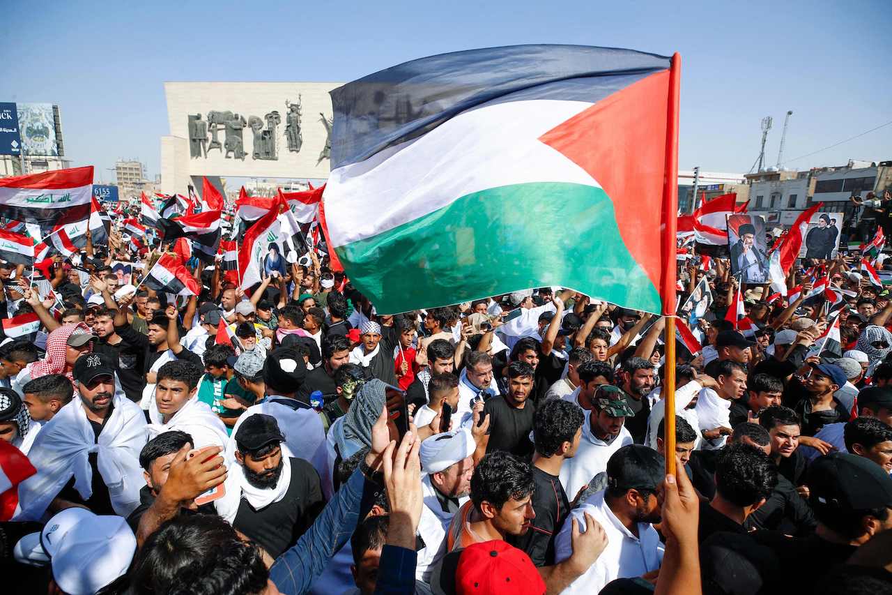Protesters take part in an anti-Israeli demonstration at Tahrir Square in Baghdad on October 13, 2023, amid the ongoing battles between Israel and Palestinian Islamist group Hamas. (AFP)