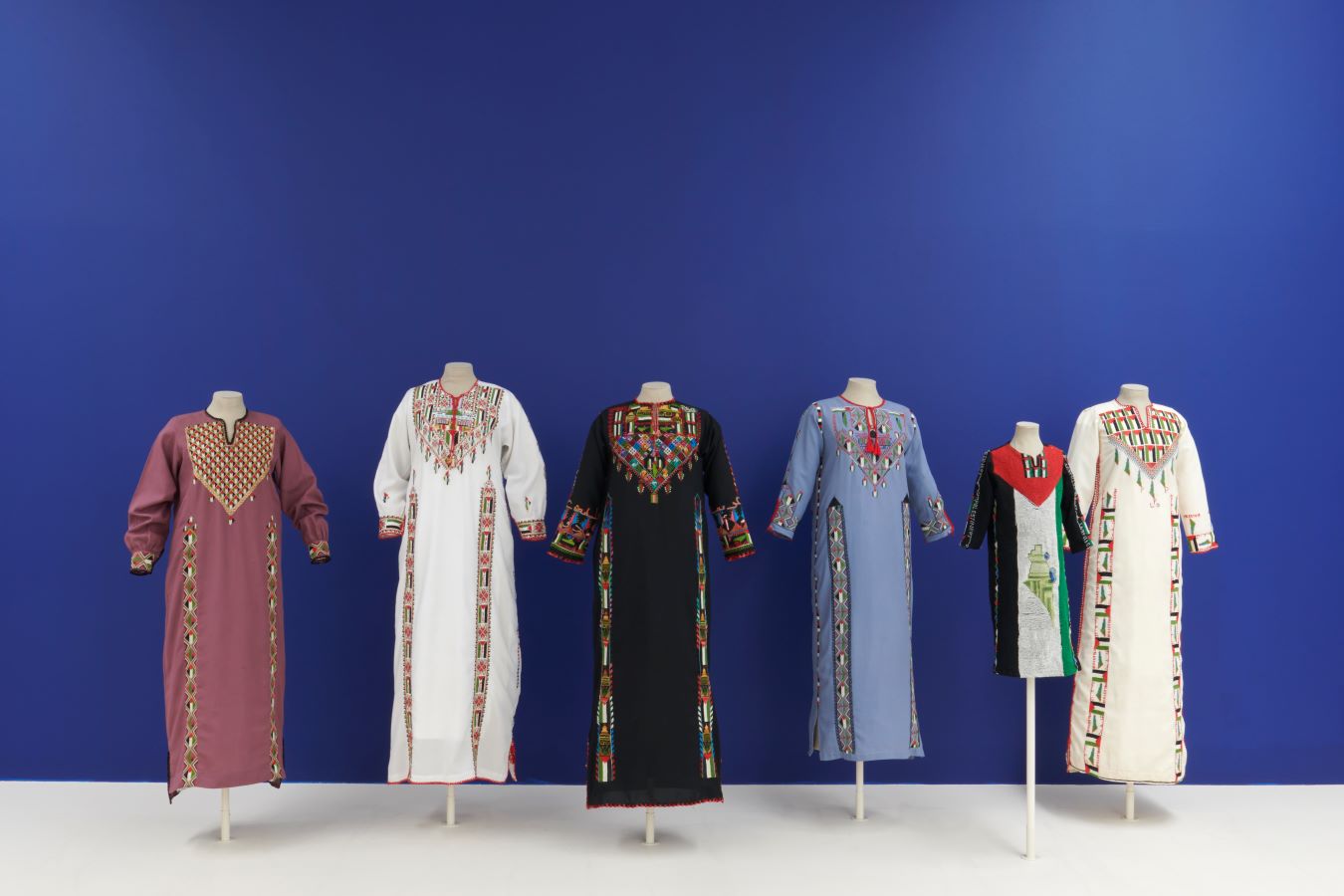 Intifada dresses, 1980s-1990s. Installation view of ‘Material Power: Palestinian Embroidery’ at Kettle’s Yard, Cambridge. (Photo by Jo Underhill)