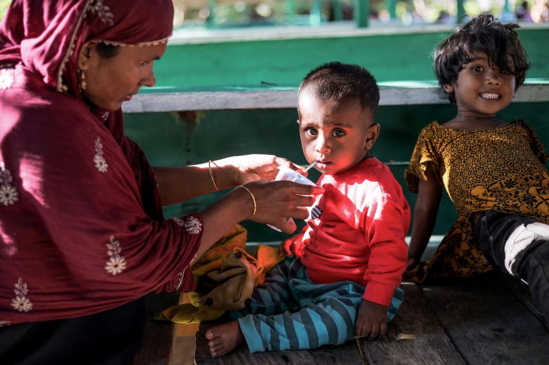 Rohingya refugees are placed in a temporary shelter for medical check up and food in Matang Pasi village, Bireun district, Aceh province on October 16, 2023. (AFP)