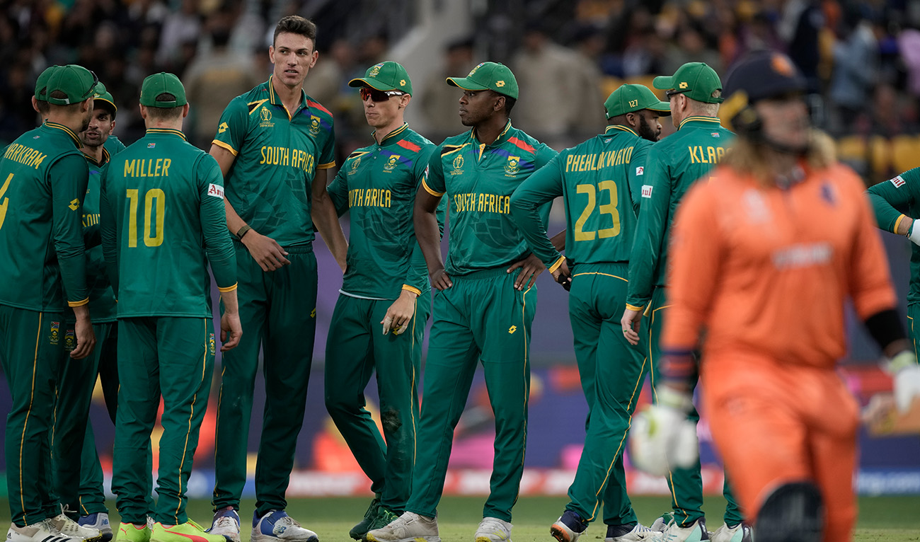 South Africa's Marco Jansen, centre without cap, celebrates the wicket of Netherlands' Max O'Dowd with his teammates during the ICC Men's Cricket World Cup match between South Africa and Netherlands in Dharamshala, India, Tuesday, Oct. 17, 2023. (AP)