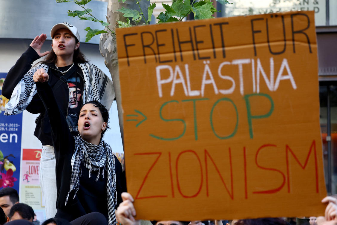 Demonstrators attend a protest in solidarity with Palestinians amid the ongoing conflict between Israel and the Palestinian Islamist group Hamas, in Frankfurt, Germany, October 14, 2023. (Reuters)