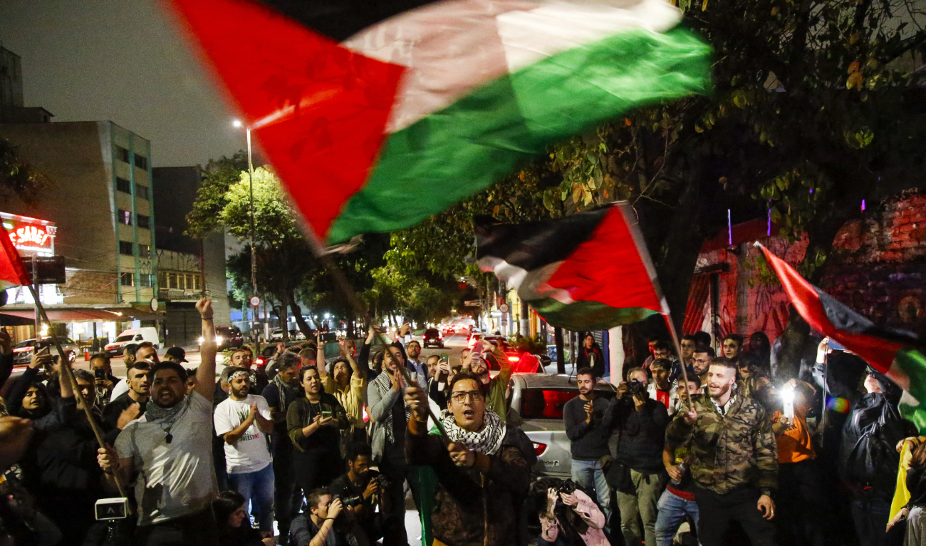 People wave Palestinian flags during a demonstration in support of Palestinians, in Sao Paulo, Brazil, on October 10, 2023. (AFP)