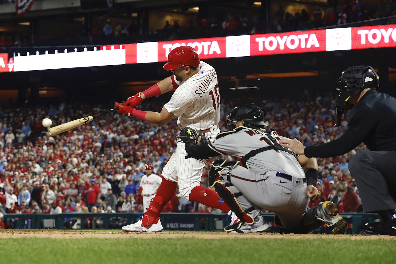 Kyle Schwarber #12 of the Philadelphia Phillies hits a home run in front of Gabriel Moreno of the Arizona Diamondbacks during Game 2 of the Championship Series at Citizens Bank Park on Tuesday in Philadelphia, Pennsylvania. (AFP)