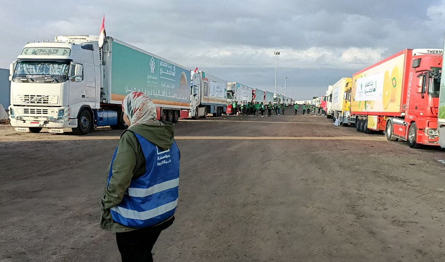 Trucks carrying humanitarian aid from Egyptian NGOs for Palestinians, wait for the reopening of the Rafah crossing at the Egyptian side, to enter Gaza on October 17, 2023. (REUTERS)