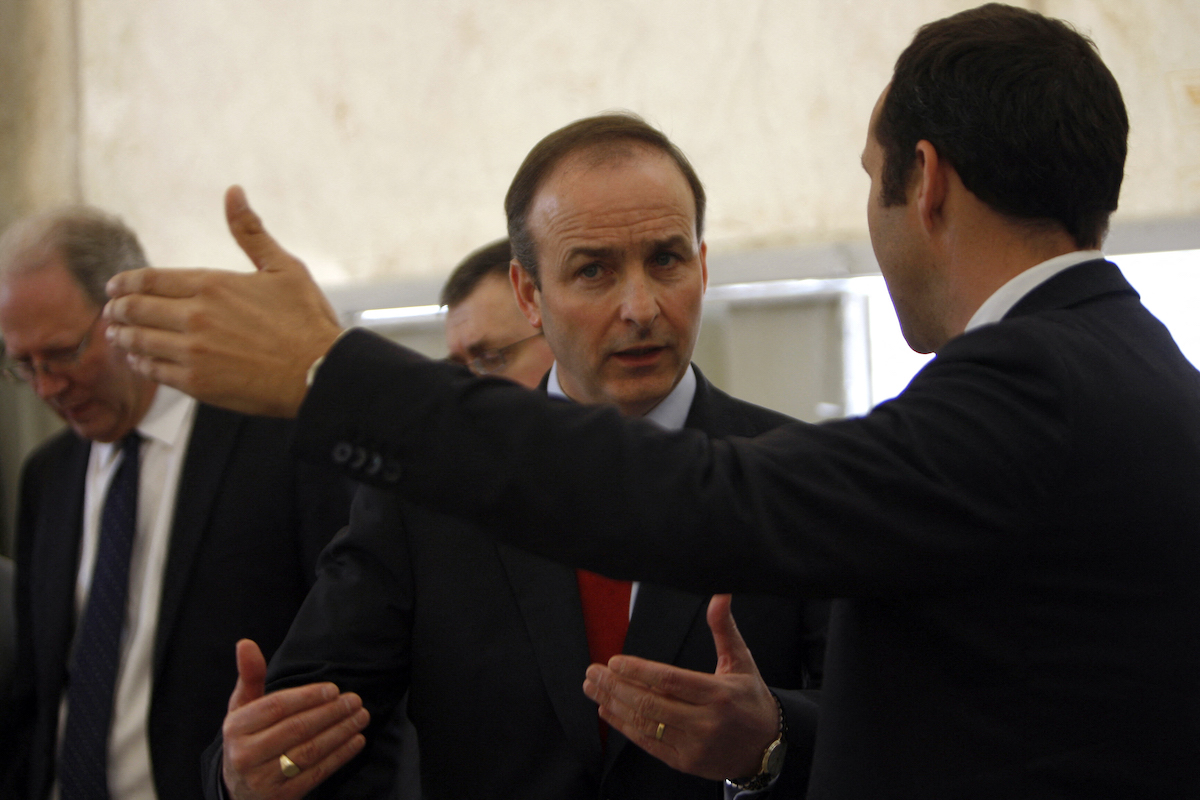 Irish Foreign Minister Micheal Martin visits UNRWA food stores at the refugee camp of Rafah in the southern Gaza Strip on February 25, 2010. (File/AFP)