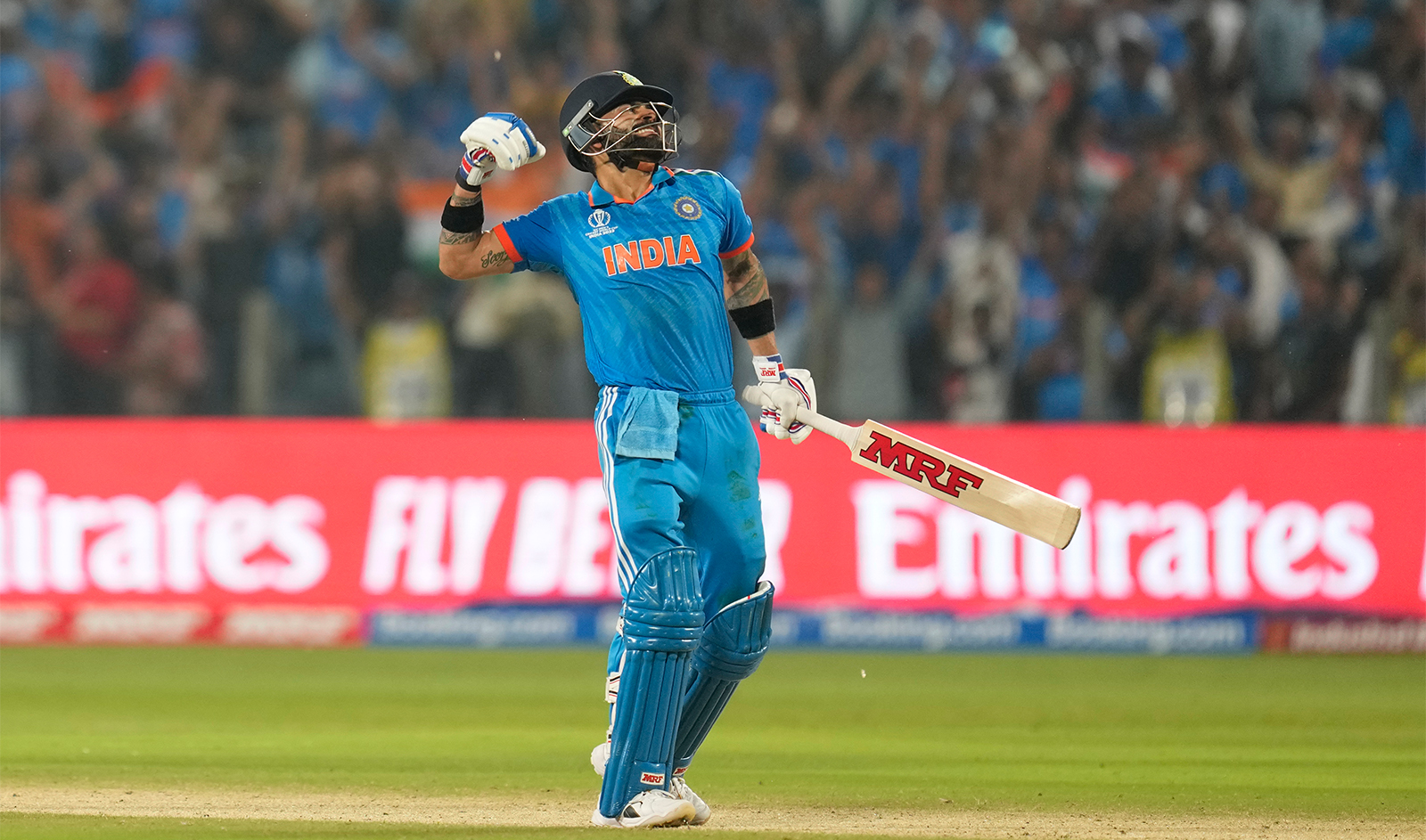 India's Virat Kohli celebrates his century during the ICC Men's Cricket World Cup match between India and Bangladesh in Pune, India, on October 19, 2023. (AP)
