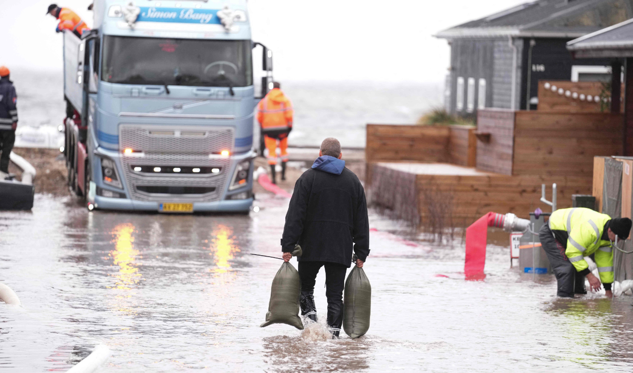Residents and members of the the Emergency Management Agency prepare for the heavy wind and increased water levels, at Kelstrup Strand, in Haderslev southern, Denmark Thursday, Oct. 19, 2023. (AP)