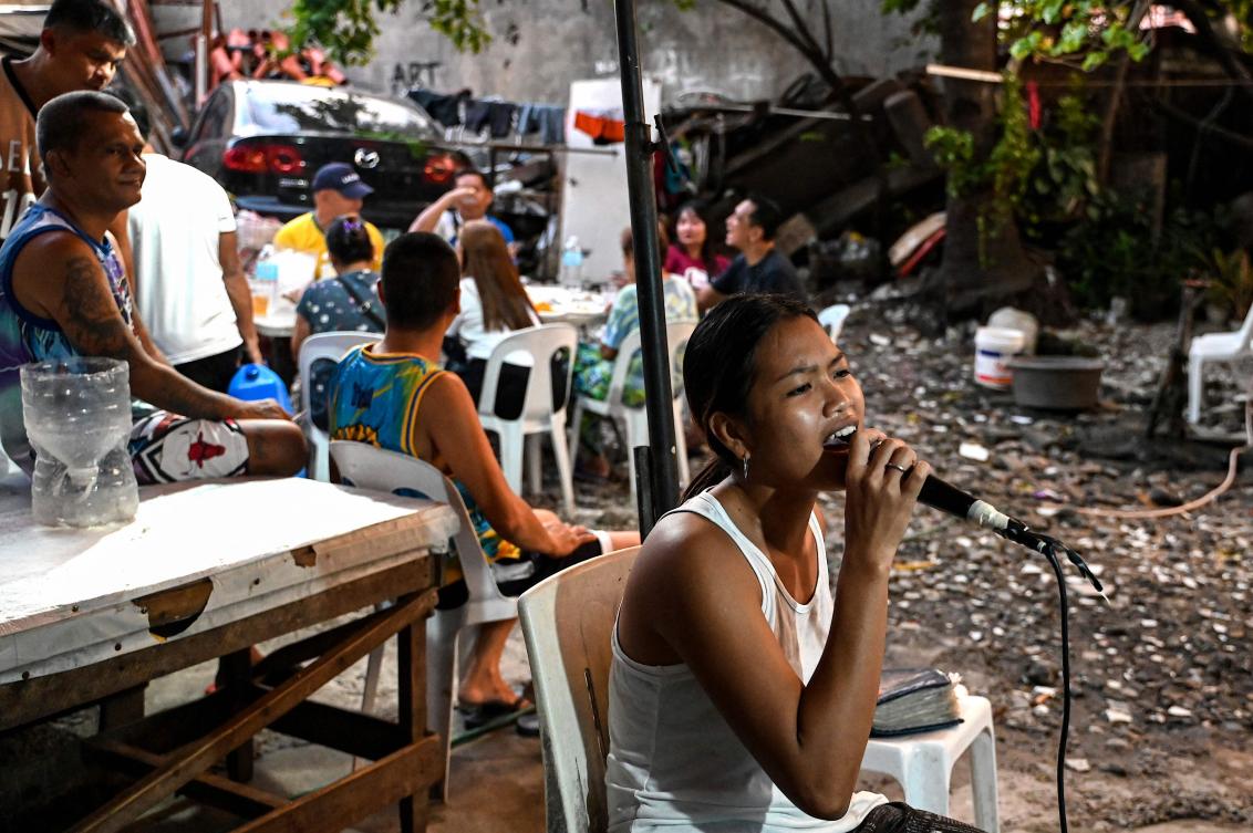 ‘We love singing’: Filipinos find joy in karaoke