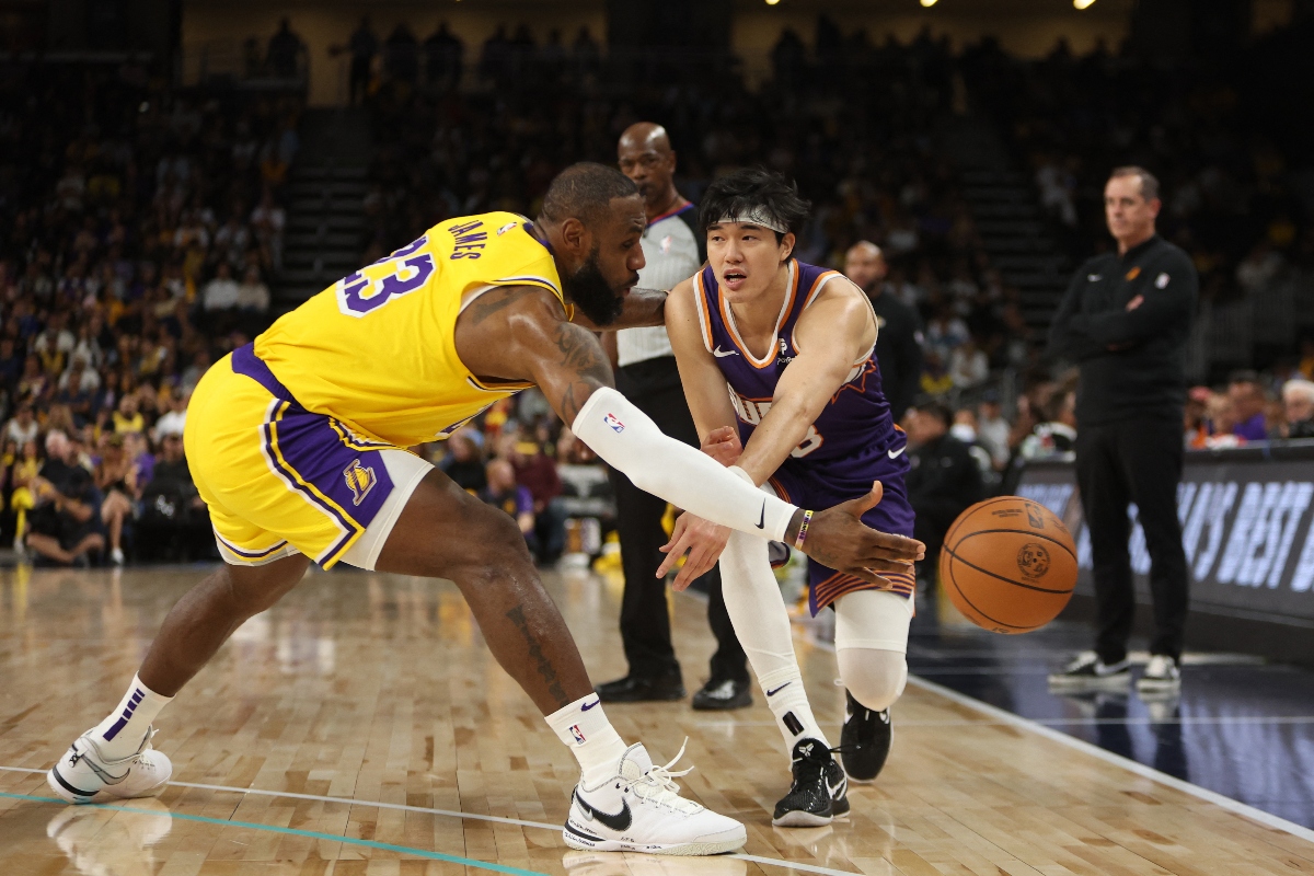 Phoenix Suns forward Yuta Watanabe's pass is deflected by Los Angeles Lakers forward LeBron James (23) during the second quarter of their NBA pre season game at Acrisure Arena. (USA TODAY Sports)