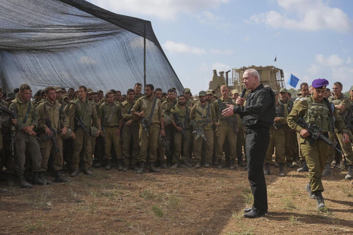 Israel's Defense Minister Yoav Gallant, wearing a protective vest, speaks with Israeli soldiers in a staging area near the border with the Gaza Strip in southern Israel. (File/AP)