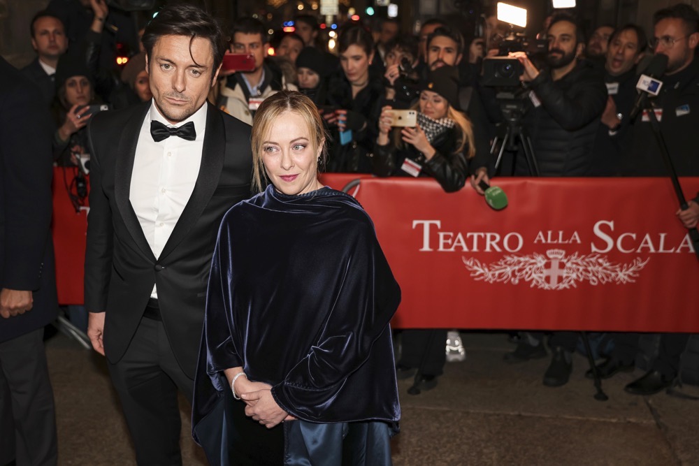 Giorgia Meloni and Andrea Giambruno arrive for the season opener at the Scala Opera house, in Milan, northern Italy. (AP)