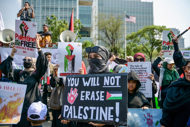 People take part in a pro-Palestinian rally in front of the US embassy building in Jakarta on October 20, 2023. (AFP)