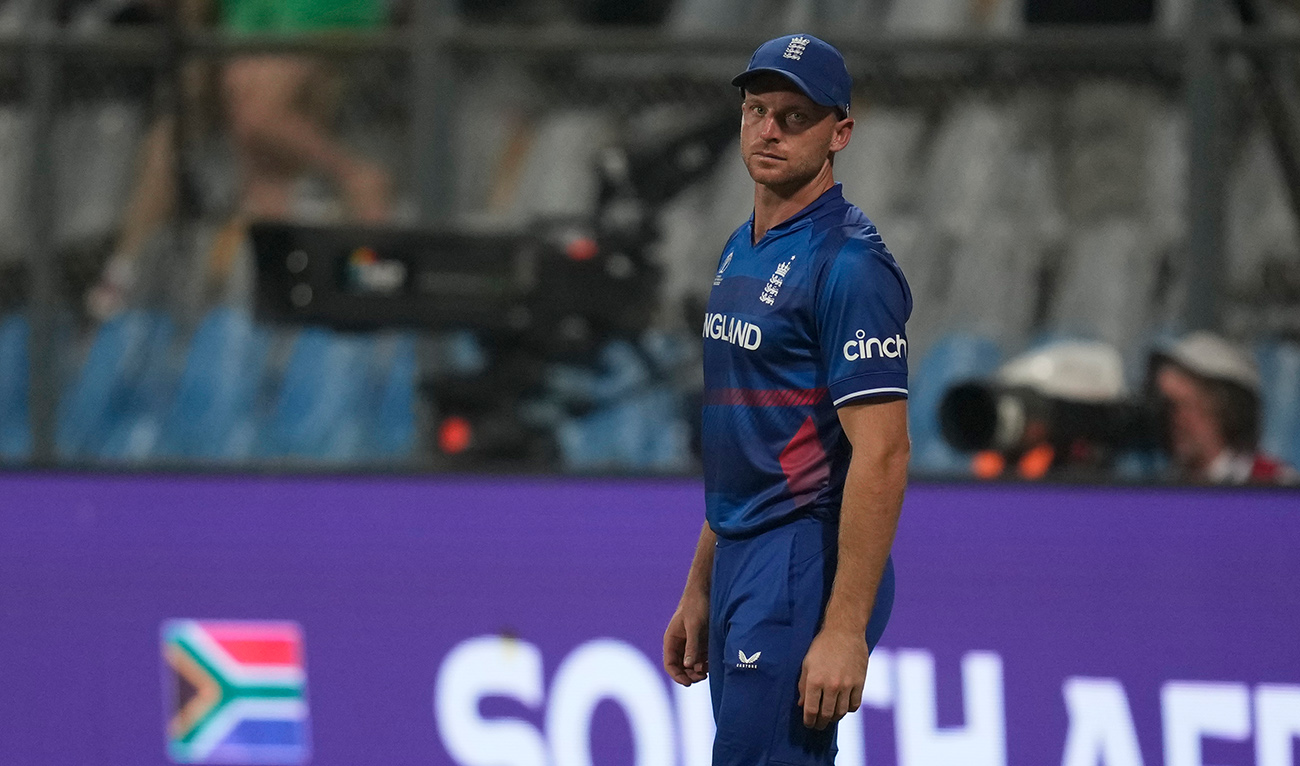 England's captain Jos Butler watches after losing the ICC Men's Cricket World Cup match against South Africa in Mumbai, India, Saturday, Oct. 21, 2023. (AP)