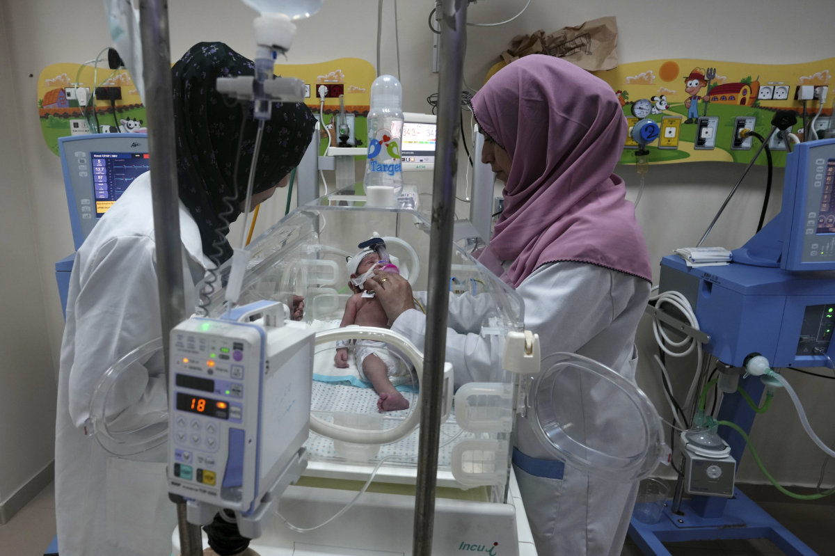 Palestinian doctors attend to a prematurely born baby at Al Aqsa Hospital in Deir el-Balah, Gaza Strip, on Oct. 22, 2023. (AP Photo/Adel Hana)