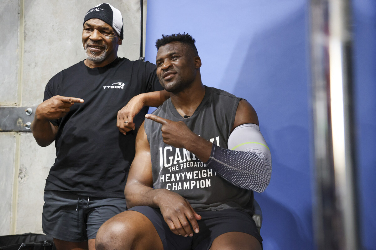 Mixed martial arts star Francis Ngannou will have heavyweight legend Mike Tyson in his corner when he faces World Boxing Council heavyweight champion Tyson Fury in the boxing ring in Saudi Arabia on October 28 (AFP)