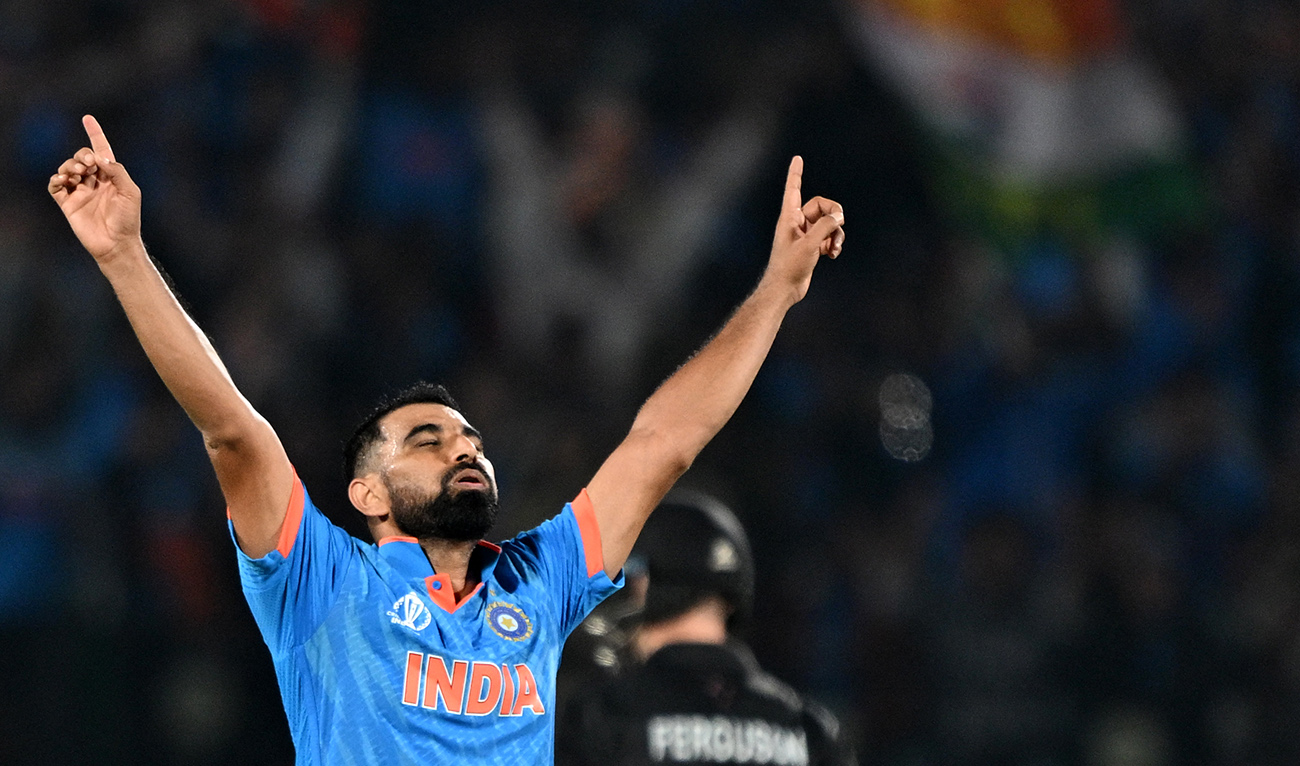 India's Mohammed Shami celebrates after taking the wicket of New Zealand's Daryl Mitchell during the 2023 ICC Men's Cricket World Cup one-day international (ODI) match between India and New Zealand at the Himachal Pradesh Cricket Association Stadium in Dharamsala on October 22, 2023. (AFP)